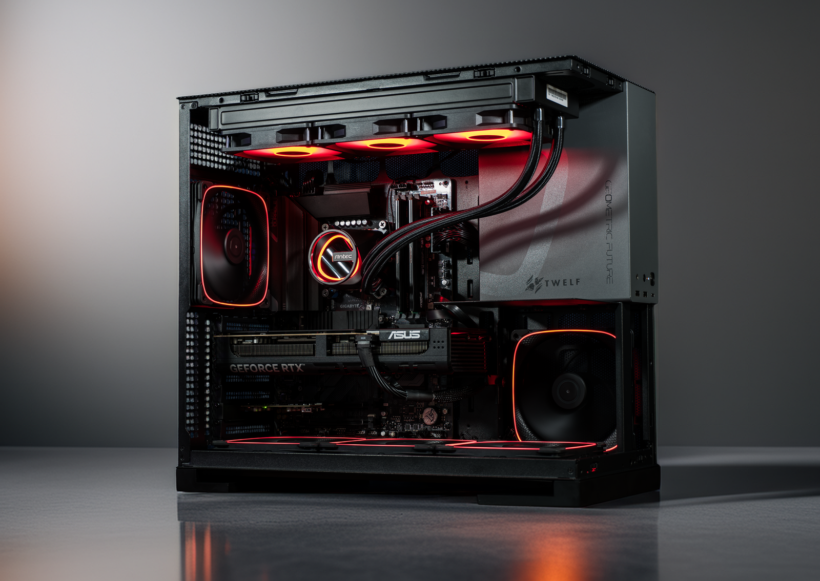 Glossy black computer case with red lighting on a reflective surface