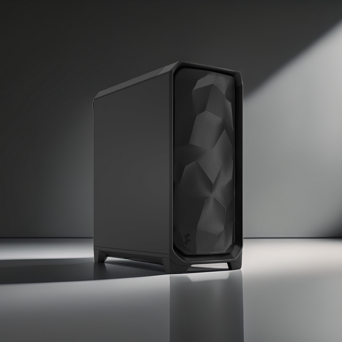 Black computer on a reflective surface with a dark background